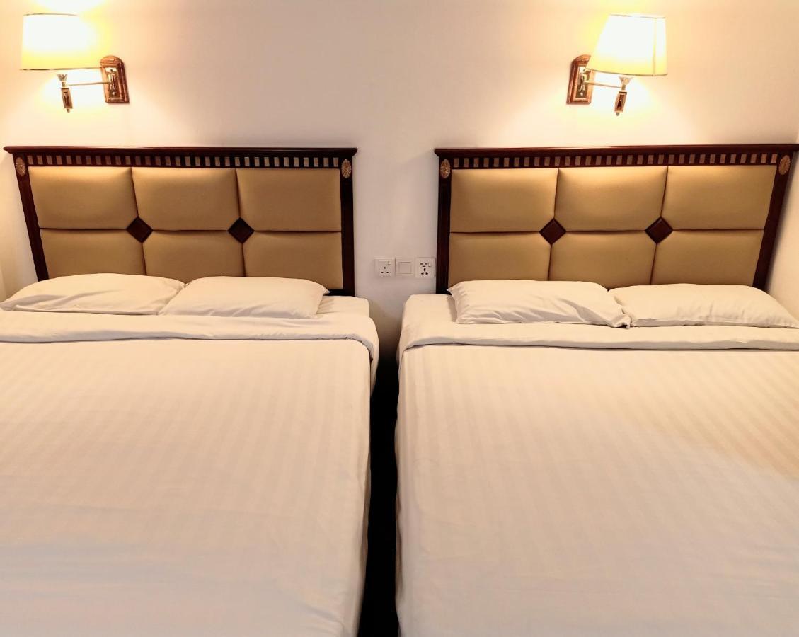 Super Oyo 90464 Borneo Suites Hotel Kota Kinabalu Bagian luar foto